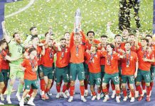 Portugal captain Cristiano Ronaldo has his teammates behind him as he hoists the Nations League trophy. AFP