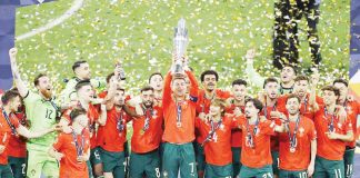 Portugal captain Cristiano Ronaldo has his teammates behind him as he hoists the Nations League trophy. AFP