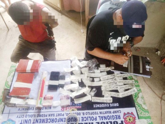 tubungan-drugs Jerald Tagundando (left) was caught with 135 grams of suspected shabu approximately valued at P918,000 during a buy-bust operation in Barangay Ingay, Tubungan, Iloilo, on June 27, 2025. RPDEU-6 PHOTO