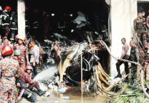 Firefighters work at the site of Bangladesh’s worst aviation accident in decades. Reuters