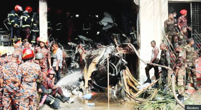 Firefighters work at the site of Bangladesh’s worst aviation accident in decades. Reuters