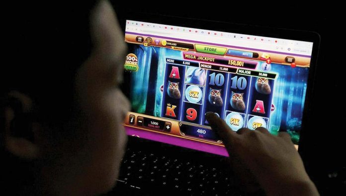 Marcos-open-copy A teen in Manila plays an online casino game accessed through a laptop. A bill has been filed in the Senate seeking an outright ban on online gambling in the country. Another bill bars the use of e-wallets in online betting. MARIANNE BERMUDEZ, PHILIPPINE DAILY INQUIRER