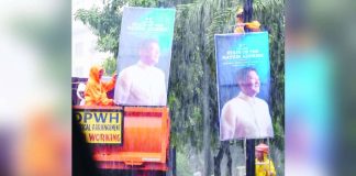 Undeterred by the heavy downpour, Department of Public Works and Highways personnel pressed on with installing tarpaulins promoting President Ferdinand “Bongbong” Marcos Jr.’s upcoming State of the Nation Address. They work full-force despite weather disruptions brought by the habagat. PHOTO COURTESY OF DWAR 1494