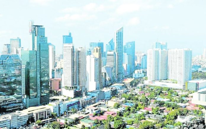 The Philippines remains stuck in the lower middle-income bracket despite an increase in per capita gross national income, based on the World Bank report. Photo shows the general view of the skyline of the financial district of Makati in Manila. PHOTO BY TED ALJIBE / AFP