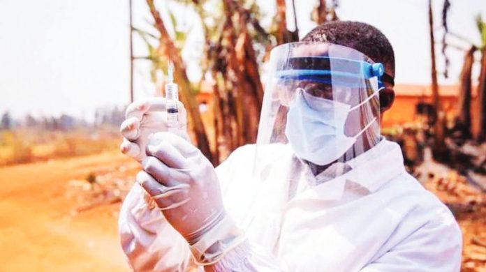 South_Africa_copy_resized A medic in full protective face mask and white clothing holds up a vaccine syringe with gloved hands. A study has examined the impact of emergency vaccine roll-outs for five major infectious diseases, including Ebola. GETTY IMAGES