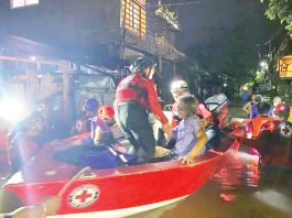 Personnel of the Philippine Red Cross Negros Occidental-Bacolod City Chapter’s Emergency Response Unit conduct rescue operation in Purok Isla, Barangay Villamonte, Bacolod City after residents experienced flooding, on Friday night, July 11, 2025. Philippine Red Cross NegOcc-Bacolod City Chapter PHOTO