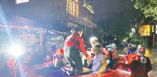 Personnel of the Philippine Red Cross Negros Occidental-Bacolod City Chapter’s Emergency Response Unit conduct rescue operation in Purok Isla, Barangay Villamonte, Bacolod City after residents experienced flooding, on Friday night, July 11, 2025. Philippine Red Cross NegOcc-Bacolod City Chapter PHOTO