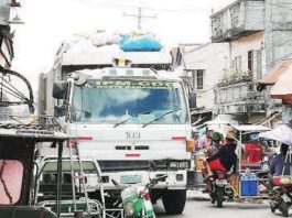 A garbage truck of IPM-Construction and Development Corp. collects garbage across Bacolod City. PNA BACOLOD FILE PHOTO