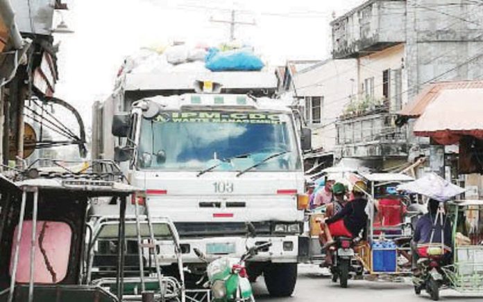 bacolod_garbage_hauler_copy_resized A garbage truck of IPM-Construction and Development Corp. collects garbage across Bacolod City. PNA BACOLOD FILE PHOTO