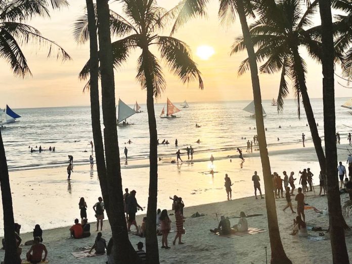 boracay_tourists_copy_resized Boracay Island in Malay, Aklan – known for its white sand beaches, crystal-clear waters, and growing range of eco-tourism and wellness activities – remains one of the Philippines’ most visited destinations. MAI LADIAO PHOTO