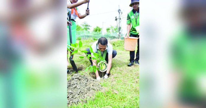 ime more than copy_superimposed Department of Education - Region 6 officer-in-charge Director Cristito Eco leads the symbolic tree planting at the Tiu Cho Teg – Ana Ros Foundation Integrated Farm School in Barangay Lanit, Jaro, Iloilo City during the launch of the ECo Champions Program on June 30, 2025. PHOTO FROM DEPED TAYO WESTERN VISAYAS REGION FACEBOOK PAGE