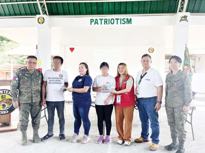 intern-dswd-rebels-copy Representatives from the Department of Social Welfare and Development, the Philippine Army’s 61st Infantry Battalion, and partner agencies turn over ₱20,000 in livelihood settlement grants to former rebels in a ceremony held in Iloilo, as part of ongoing reintegration and peace-building efforts under the government’s whole-of-nation approach. PHILIPPINE INFORMATION AGENCY 6 PHOTO
