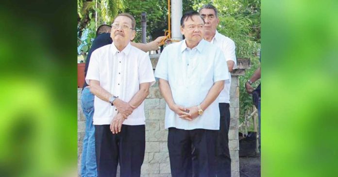 Atty. Edgar Gil (left) stands beside then-Iloilo City mayor Jerry Treñas during a flag-raising ceremony. Gil, a long-serving City Legal Officer and respected public servant, passed away on July 3, 2025, just a day after his reappointment was confirmed. MIGUEL TREÑAS FACEBOOK PAGE