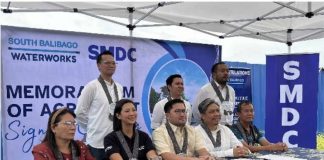 (From left) Barangay Buhang Captain Ma. Jenny Celiz, South Balibago Waterworks president Cristina Isabelle P. Alejandro, Iloilo City Councilor Nene DeLa Llana, SMDC assistant vice president for Project Development and Management Neil Brian J. Serantes, Barangay Balabago Captain Antonio Jacoba. (Standing from left) Redenne O. Tadeo, SMDC Pre-Operations and Technical Group head, Dareen Carl P. Navarro, SMDC Project Development and Management manager, and Rommel YU, SMDC VP for Engineering VISMIN, pose for a photo after signing the Memorandum of Agreement to provide reliable water supply to Glade Residences in Jaro district.