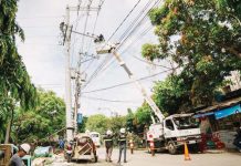 MORE Electric and Power Corporation personnel assist Iloilo City’s Task Force Boltahe in tracing and disconnecting illegal electrical connections along a barangay road — part of intensified efforts to prevent fire hazards and electricity theft. MORE POWER PHOTO