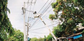 MORE Electric and Power Corporation personnel assist Iloilo City’s Task Force Boltahe in tracing and disconnecting illegal electrical connections along a barangay road — part of intensified efforts to prevent fire hazards and electricity theft. MORE POWER PHOTO