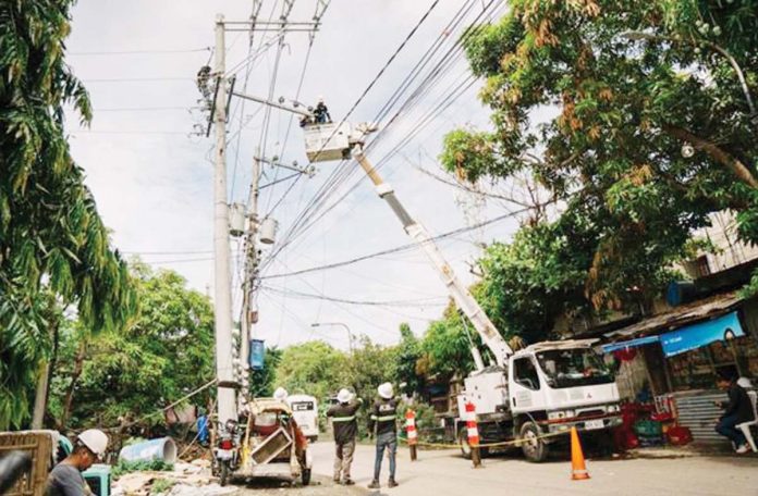 mai-Task-Force-Boltahe-copy MORE Electric and Power Corporation personnel assist Iloilo City’s Task Force Boltahe in tracing and disconnecting illegal electrical connections along a barangay road — part of intensified efforts to prevent fire hazards and electricity theft. MORE POWER PHOTO