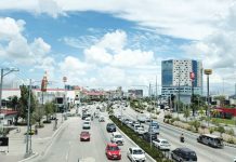 CLEAN, ORDERLY, LIVABLE. A bright midday view of Iloilo City’s Diversion Road (Sen. Benigno Aquino Jr. Avenue) showcases its well-maintained thoroughfares, landscaped center islands, and modern infrastructure — factors being considered as the city undergoes validation for the 2025–2027 ASEAN Clean Tourist City Award. MAI LADIAO/PN