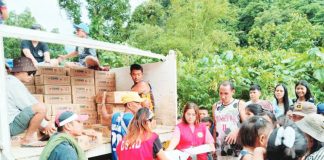 Department of Social Welfare and Development personnel distribute family food packs to residents of Barangay Alopijan, Culasi, Antique on July 23, following the onslaught of heavy rains brought by the enhanced southwest monsoon (habagat) intensified by recent tropical cyclones. DSWD PHOTO