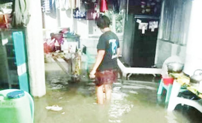 mai leptos 3 copy A resident wades through floodwaters inside her home in Iloilo City — a high-risk exposure that health officials warn could lead to leptospirosis if preventive medication is not taken promptly. ILOILO CITY DRRMO PHOTO
