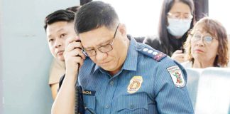 Iloilo City police director Police Colonel Kim Legada monitors real-time response during a live 911 emergency simulation drill, as part of the city police’s rollout of its new 5-minute response time protocol. ICPO PHOTO