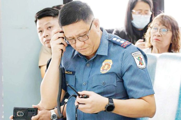 mai_5_minutes_copy_resized Iloilo City police director Police Colonel Kim Legada monitors real-time response during a live 911 emergency simulation drill, as part of the city police’s rollout of its new 5-minute response time protocol. ICPO PHOTO