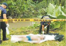 Police recover the body of a 14-year-old boy who drowned in Buntatala Creek in Barangay Tagbak, Jaro, Iloilo City following severe flooding — an incident that has intensified public outrage and prompted calls to stop the ongoing creekside project blamed for obstructing water flow. AJ PALCULLO/PN