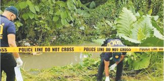 Police recover the body of a 14-year-old boy who drowned in Buntatala Creek in Barangay Tagbak, Jaro, Iloilo City following severe flooding — an incident that has intensified public outrage and prompted calls to stop the ongoing creekside project blamed for obstructing water flow. AJ PALCULLO/PN