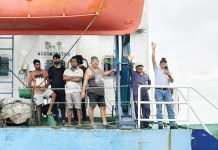 Sanctions await agency of rescued seafarers in Iloilo Filipino and Indian crew members of MV Hirman Star wave from the deck of their problematic vessel. They were rescued following weeks of being stuck off Loboc Port, Iloilo City due to the vessel’s unseaworthy condition and unresolved violations. PHOTO BY CONG. JULIENNE BARONDA