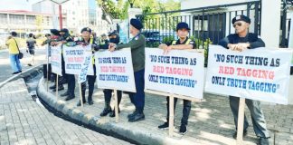 Members of the Samahan ng Defense Force Multiplier and Alliance for Peace, Environment, and Sustainability stage a protest outside the Iloilo Provincial Capitol on July 28, 2025, calling for an end to youth recruitment by communist insurgents and showing support for President Ferdinand “Bongbong” Marcos Jr.’s anti-insurgency programs ahead of his State of the Nation Address. AJ PALCULLO/PN