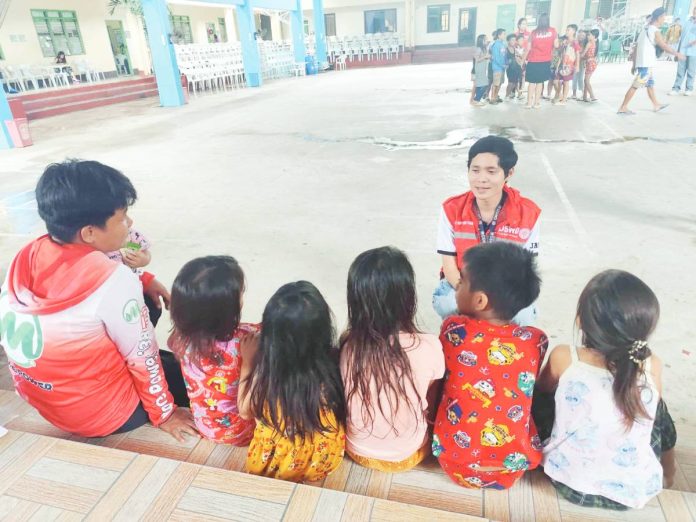 neljoy psycho copy A Department of Social Welfare and Development staff member engages children in a psychosocial support session at an evacuation center in Iloilo City, helping young evacuees process their experiences after being displaced by Tropical Storm Crising and monsoon flooding. PHOTO BY DSWD WESTERN VISAYAS