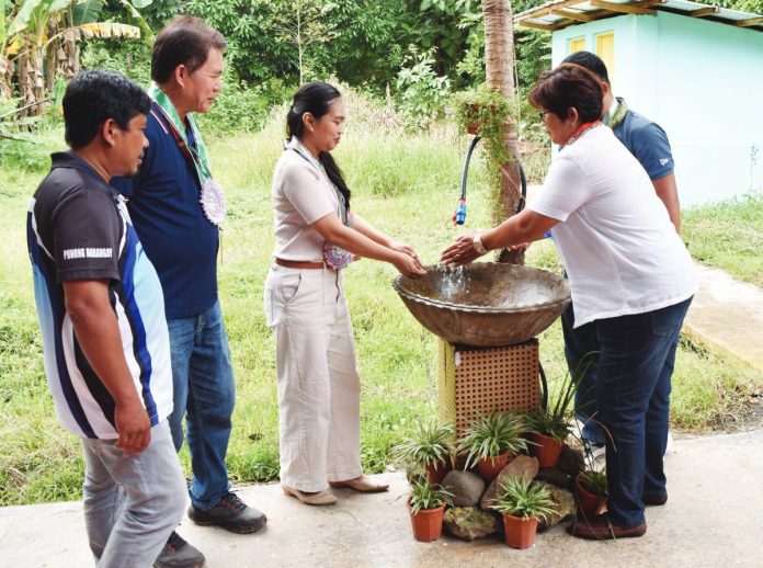 neljoy water project copy Barangay leaders and local officials test a new water facility during the inauguration of the P1.7-million water system project in Barangay San Fernando, Miag-ao, Iloilo — bringing clean and reliable water access to nearly 200 households. PHOTO FROM BALITA HALIN SA KAPITOLYO