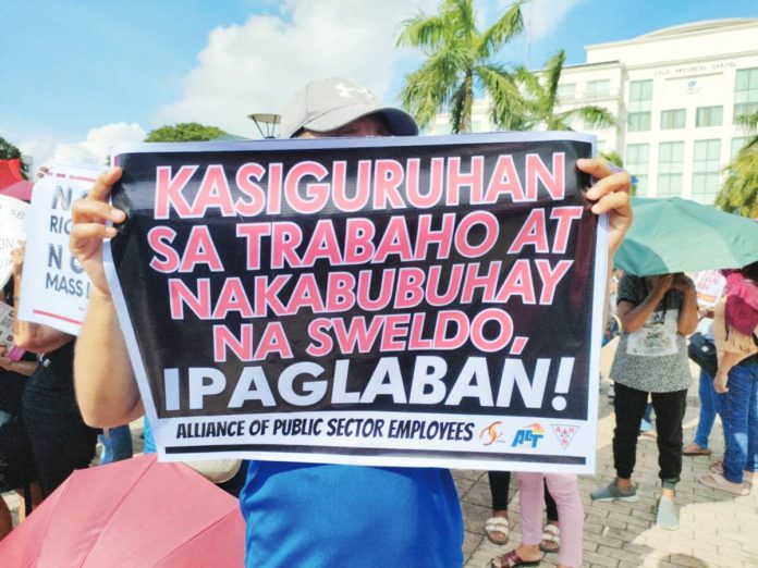 neljoy_anti-SONA_resized A protester holds a placard demanding job security and a living wage during a protest rally in front of the Iloilo Provincial Capitol on July 28, 2025, joining other activists from across Western Visayas who called for urgent government reforms amid President Ferdinand “Bongbong” Marcos Jr.’s State of the National Address. AJ PALCULLO/PN