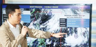 Weather specialist Benison Estareja reports updates on Tropical Storm “Dante” and Typhoon “Emong” from the Philippine Atmospheric Geophysical and Astronomical Services Administration’s forecasting center in Quezon City. PNA