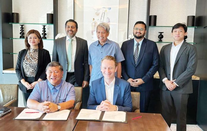 secondary_primelectric_resized RENEWABLE ENERGY PUSH. Primelectric Holdings President Roel Z. Castro and ACWA Power Chief Investment and Development Officer Thomas Brostrom sign a joint study agreement, marking a strategic collaboration on renewable energy exploration. The ceremonial signing, held recently in Manila, was witnessed by top executives from both companies.
