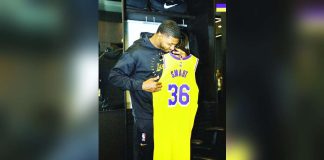Marcus Smart happily looks at his Los Angeles Lakers’ jersey. PHOTO COURTESY OF LA LAKERS