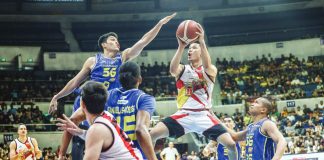 Aklanon Kris Rosales of San Miguel Beermen tries to score against the defense of TNT Tropang 5G’s Calvin Oftana. PBA PHOTO