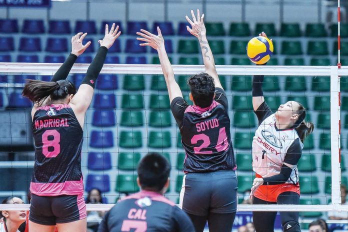 sports-Robles Ilongga Princess Ann Robles of Chery Tiggo Crossovers tries to score against the defense of Negrense Christine Joy Soyud of Akari Power Chargers. PVL PHOTO