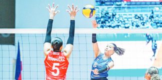 Chinnie Arroyo of ZUS Coffee Thunderbelles attempts to score against the defense of Imee Hernandez of Chery Tiggo Crossovers. PVL PHOTO