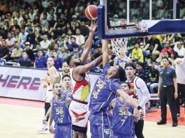San Miguel Beermen’s Moala Tautuaa scores against the defense of TNT Tropang 5G’s Brandon Ganuelas-Rosser. PBA PHOTO