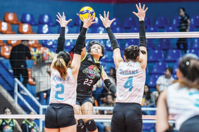 sports_Nxled_copy_resized Jovelyn Fernandez of Nxled Chameleons scores against the defense of Galeries Tower Highrisers. PVL PHOTO