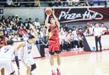 San Miguel Beermen’s Celedonio Trollano pulls up for a three-point shot against the defense of TNT Tropang 5G’s Roger Pogoy. PBA PHOTO