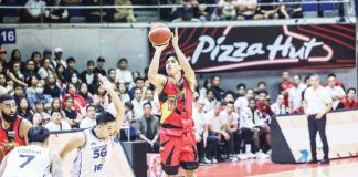 San Miguel Beermen’s Celedonio Trollano pulls up for a three-point shot against the defense of TNT Tropang 5G’s Roger Pogoy. PBA PHOTO