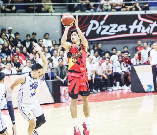 San Miguel Beermen’s Celedonio Trollano pulls up for a three-point shot against the defense of TNT Tropang 5G’s Roger Pogoy. PBA PHOTO
