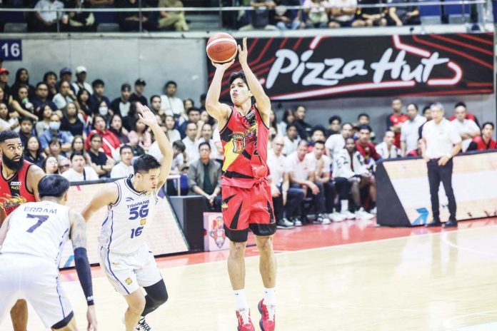 sports_PBA_copy_resized San Miguel Beermen’s Celedonio Trollano pulls up for a three-point shot against the defense of TNT Tropang 5G’s Roger Pogoy. PBA PHOTO