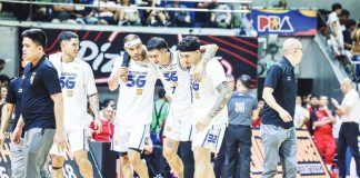TNT Tropang 5G’'s John Paul Erram was assisted by his teammates after suffering an injury. PBA PHOTO