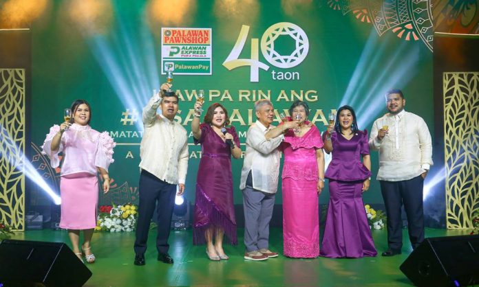 1 - Partner's Night Toast Palawan Group of Companies executives raise a toast to 40 years of shared success, trust, and service excellence.