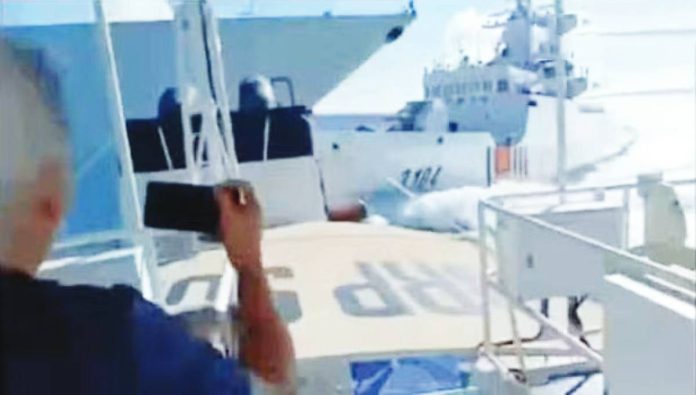 Chinese Coast Guard copy This screengrab from the Philippine Coast Guard’s video handout shows a China Coast Guard vessel colliding with a Chinese Navy warship off Scarborough (Panatag) Shoal on Monday.