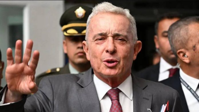 Colombia Colombian former President Álvaro Uribe gestures as he speaks to the press outside a court complex at the end of his trial in Bogota on February 10, 2025. AFP VIA GETTY IMAGES