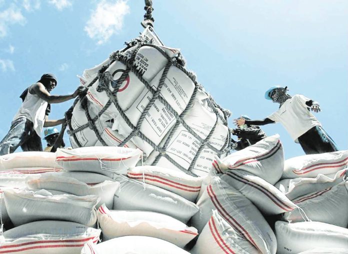 DA proposal File photo shows imported rice from Vietnam being unloaded in Surigao City. PHOTO COURTESY OF INQUIRER.NET